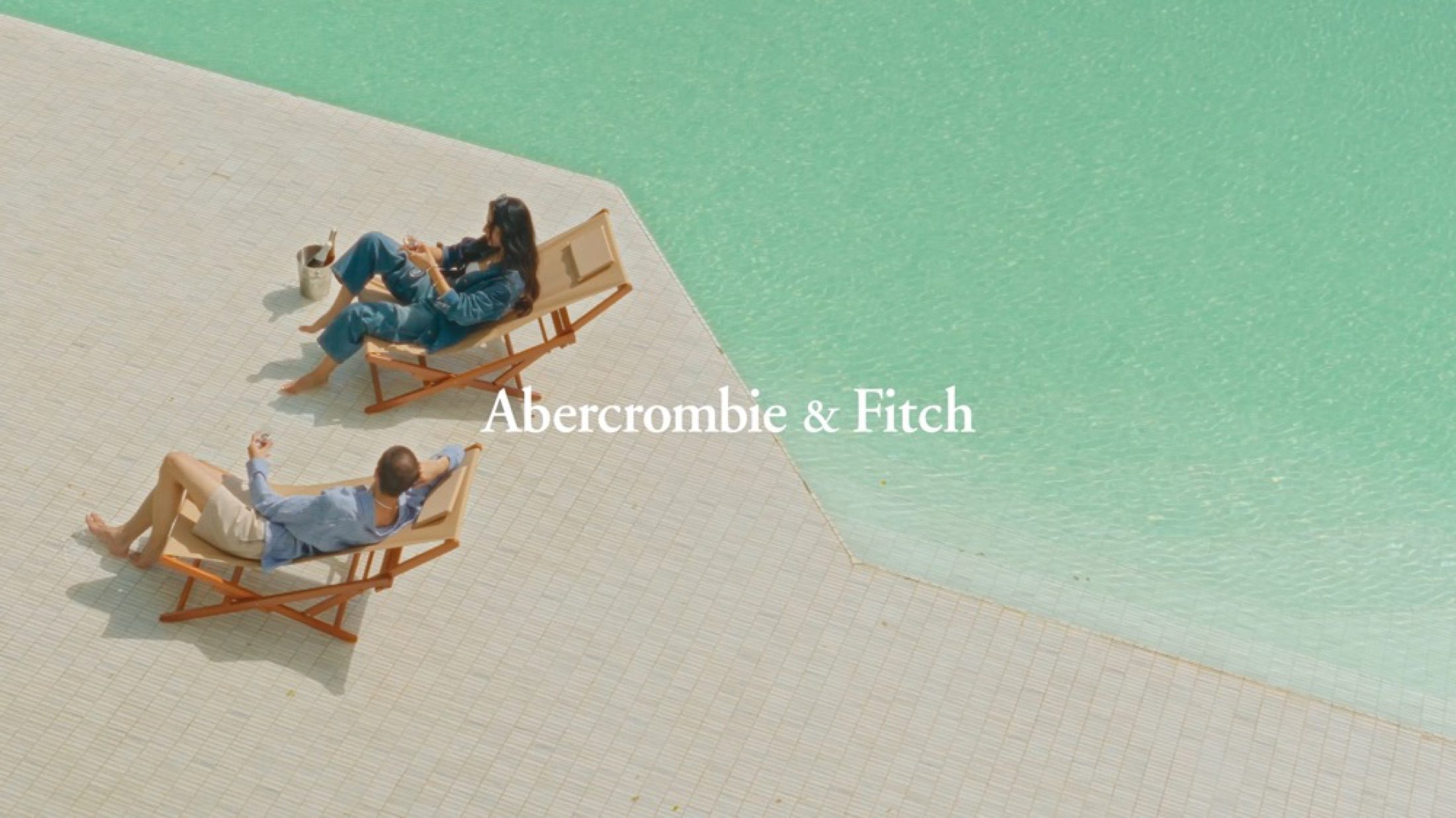Abercrombie and Fitch campaign frame with pool-side brand mark